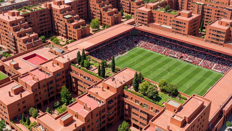 Aerial view of a stadium inside a terracotta housing block