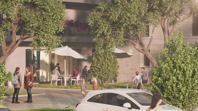 Street with residents in front of a new housing block