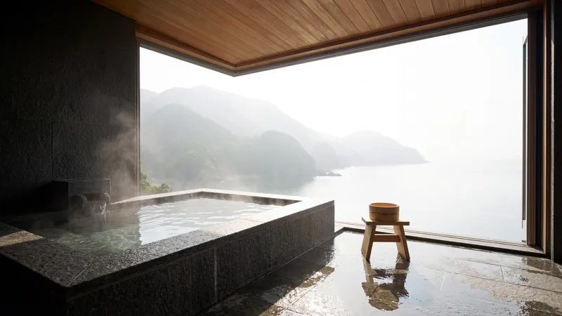 Stone bath with a misty mountain view