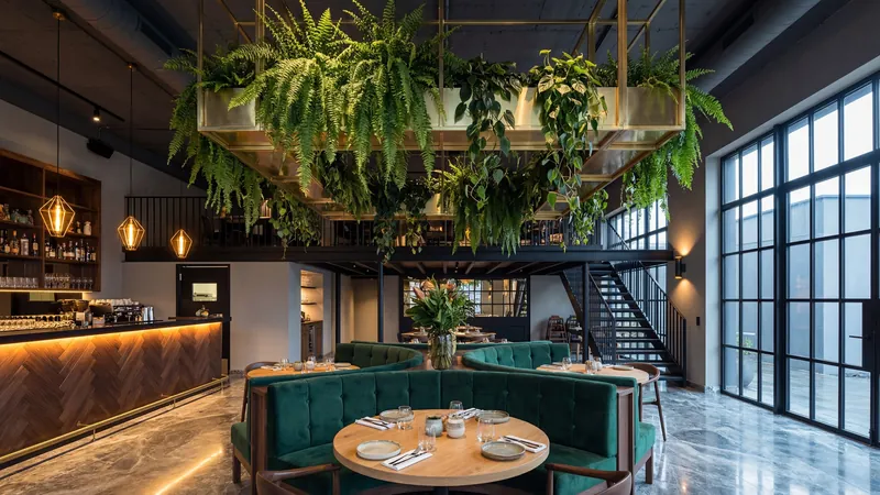 Bar with hanging plants and a dining area