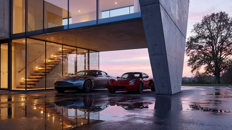 Cantilevered villa with sports cars at sunset